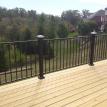    pressure treated lumber with black fortress railing with Deckarator solar lin
